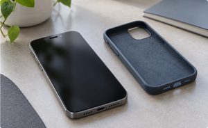 Smartphone beside a removed protective case for checking blocked speaker and receiver openings